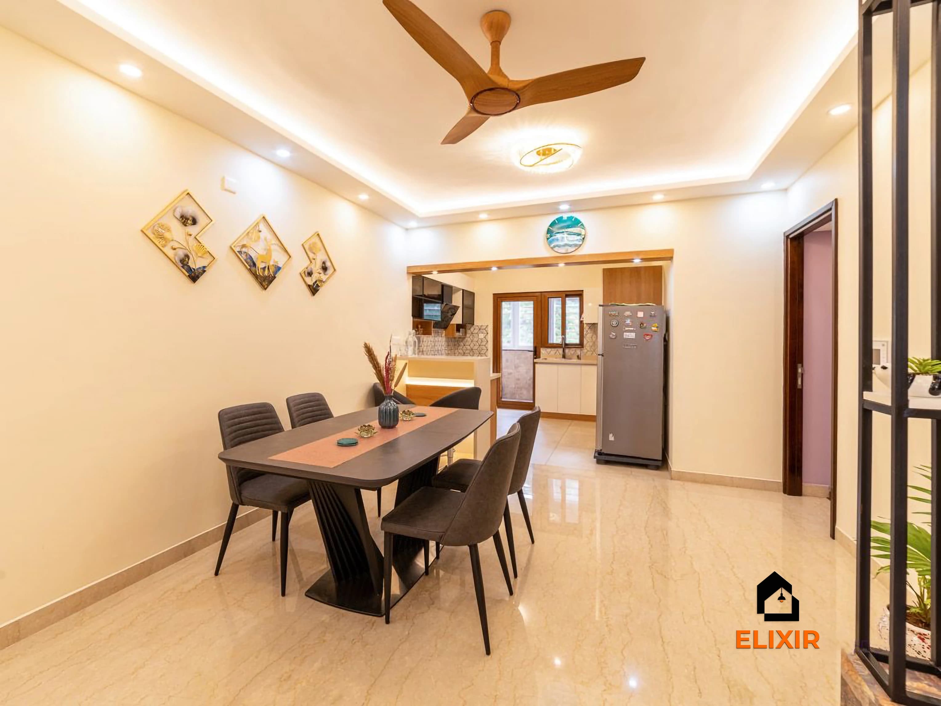 Dining area with a six-seater table, pendant light and a cove-lit false ceiling, Perungudi